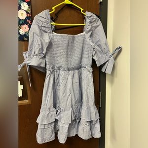 Smocked top dress. New with tags. Can be worn on or off the shoulder.